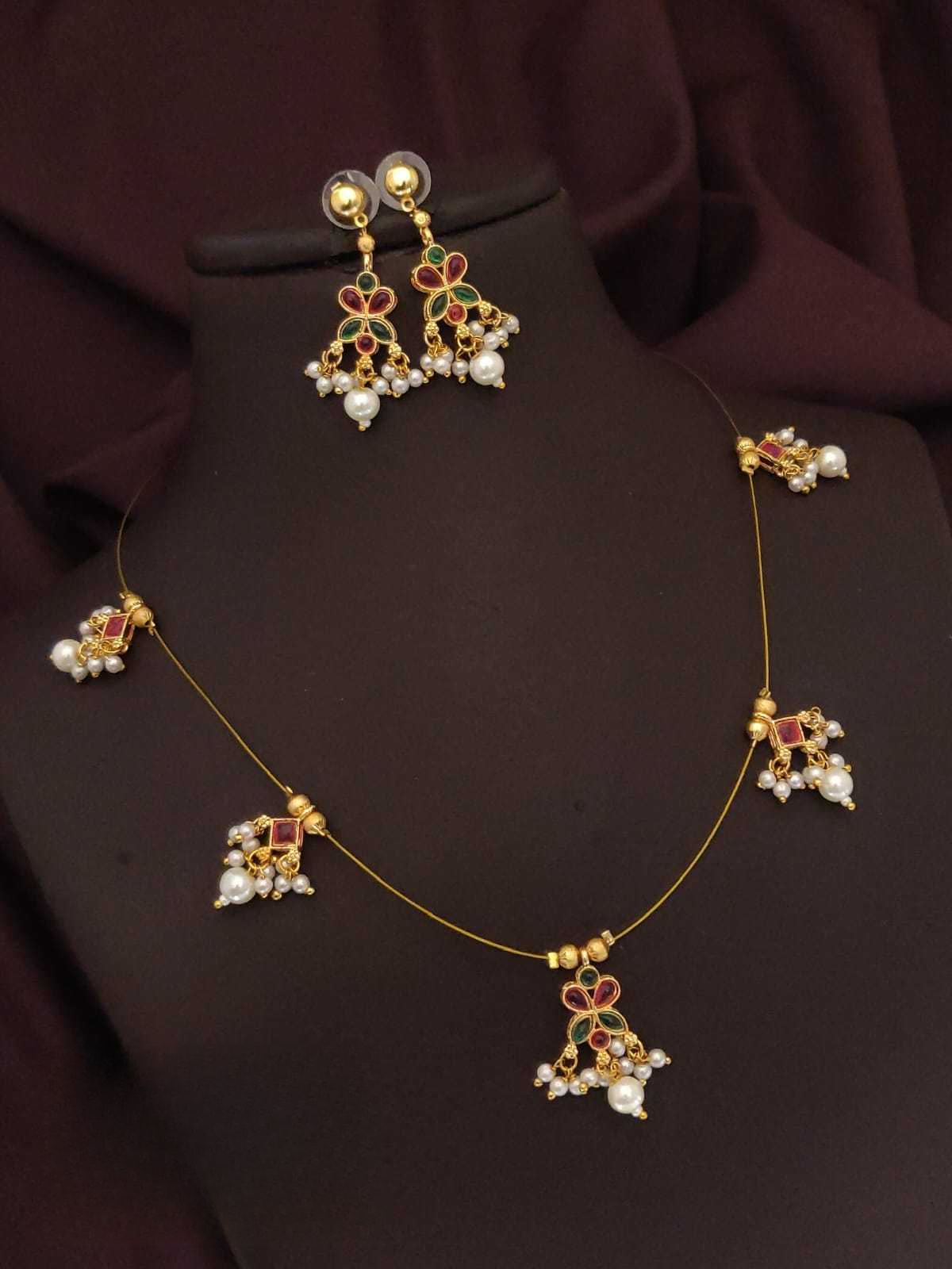 Jewelry set with necklace and earrings on a dark background