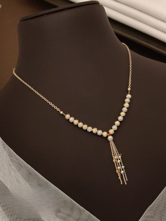 Necklace with beads and tassel on a mannequin neck